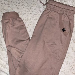 Tan ish Gymshark joggers. Only worn a few times. In perfect conditions! :)
